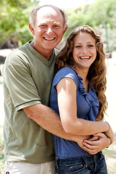 Aged father embracing her daughter — Stock Photo, Image