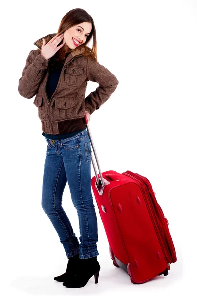 Ung dam poserar med bagage — Stockfoto