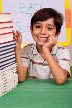 Young school kid smiling at camera clipart