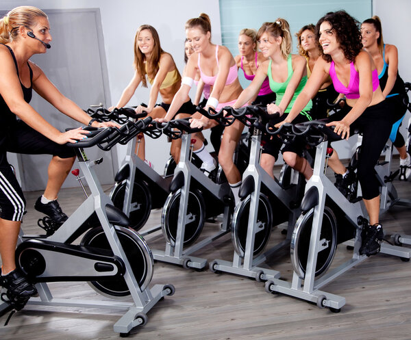Group of doing exercise on a bike