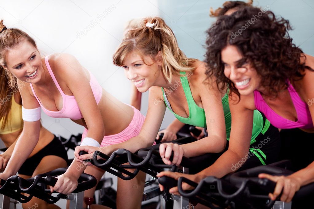 Women at the gym doing cardio exercises
