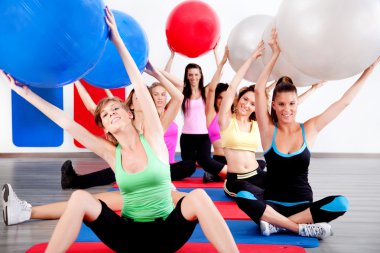 doing stretching exercise with fitness balls clipart