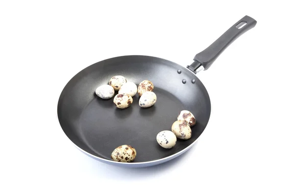 Quail eggs in a frying pan — Stock Photo, Image
