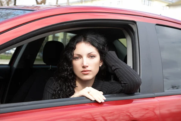 stock image Portrait of the girl sitting in car