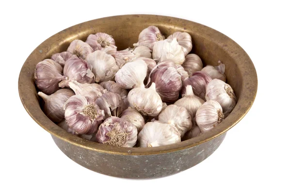 Garlic heads in an old basin — Stock Photo, Image