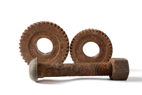 Rusty gears and bolt with a nut on white background — Stock Photo, Image