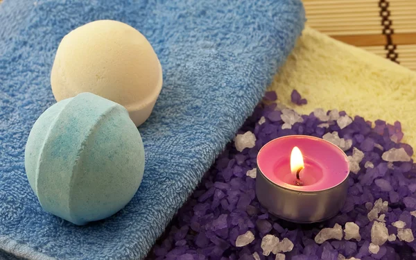 Salt with candle and bath balls — Stock Photo, Image
