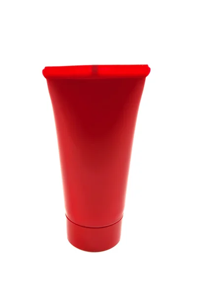 Röd kosmetiska tub — Stockfoto