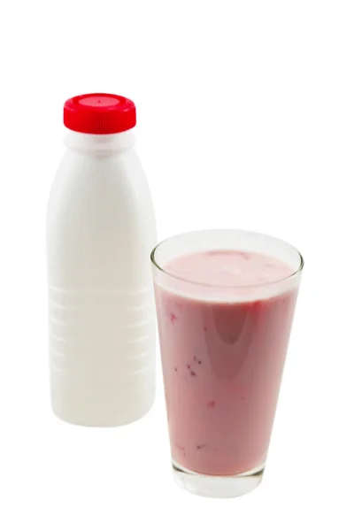 Пляшка і склянка з йогуртом — стокове фото