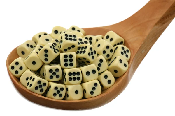 Dice in a wooden spoon — Stock Photo, Image