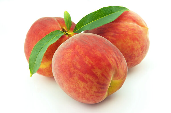 Three ripe peaches