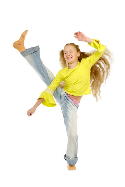 The girl is engaged in aerobics on a white background