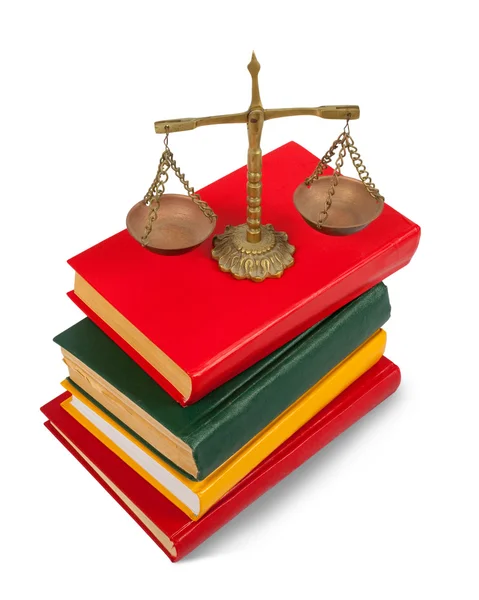Book and scales of justice over white — Stock Photo, Image