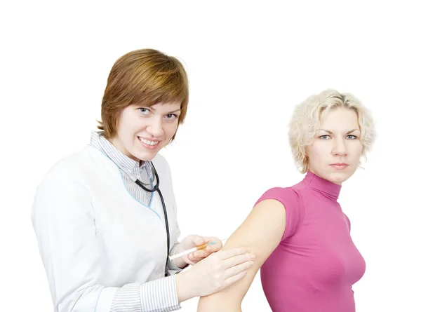 Doctor giving a girl an injection Stock Picture