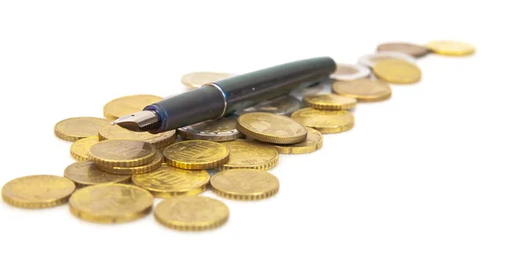 Ручка на монетах євро — стокове фото