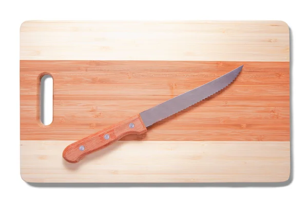 stock image Knife over cutting board