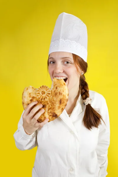Baker is het eten van brood — Stockfoto