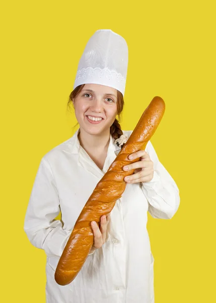 Baker is showing French stick — Stock Photo, Image