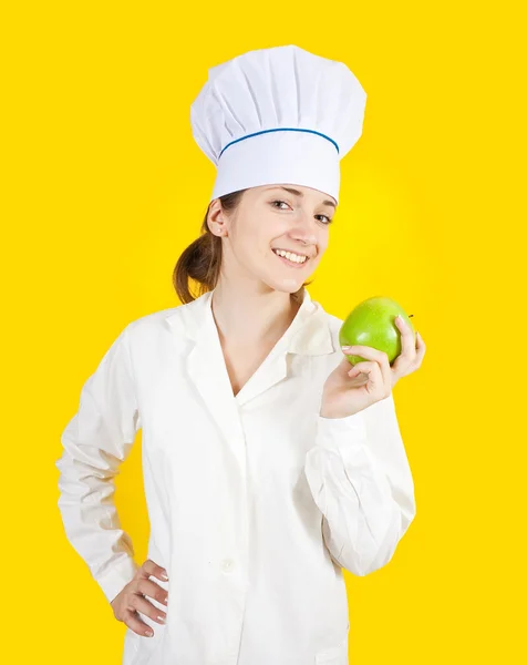 Femmina cuoco tenuta mela — Foto Stock