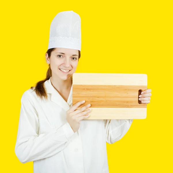 Šéfkuchař drží prkénko — Stock fotografie