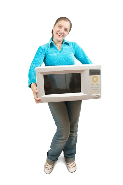 Chica con horno microondas —  Fotos de Stock