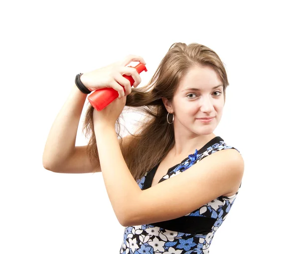 Girl spraying hair over white — Stock Photo, Image