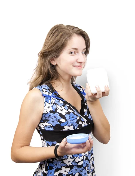 Girl with white cosmetic container — Stock Photo, Image