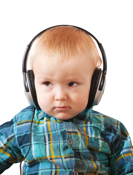 Menino pequeno com fones de ouvido o — Fotografia de Stock