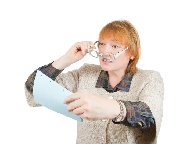 Senior woman reading a paper — Stock Photo, Image