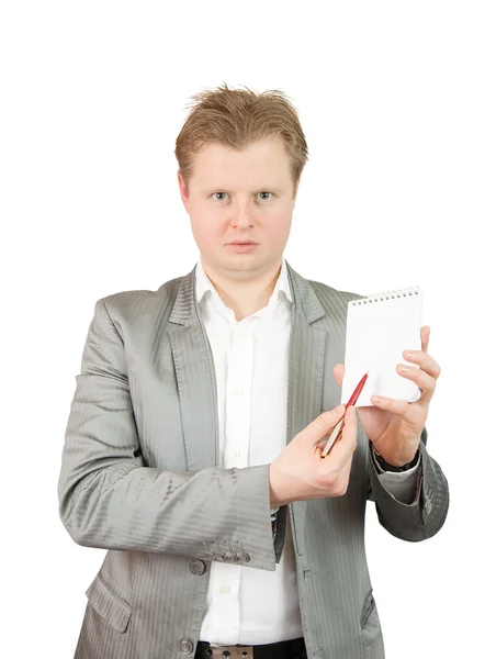Businessman pointing at blank notepad — Stock Photo, Image