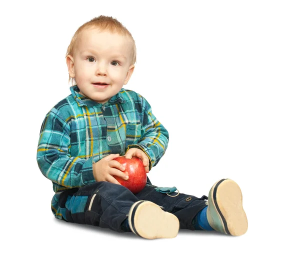 Menino em camisa chequered com maçã — Fotografia de Stock