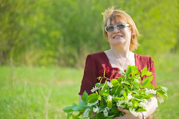 Woman in the spring garden — Stock Photo, Image