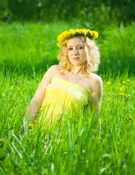 Girl in chaplet in meadow — Stock Photo, Image