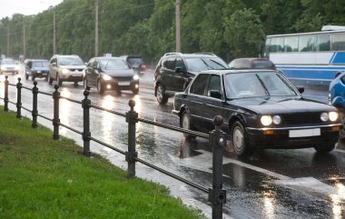 Dense traffic on a rainy evening clipart