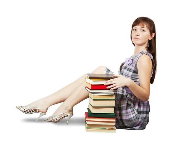 Estudiante sentado con pila de libros — Foto de Stock
