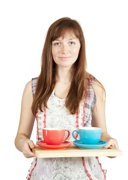 Menina com conjunto de xícaras de chá — Fotografia de Stock