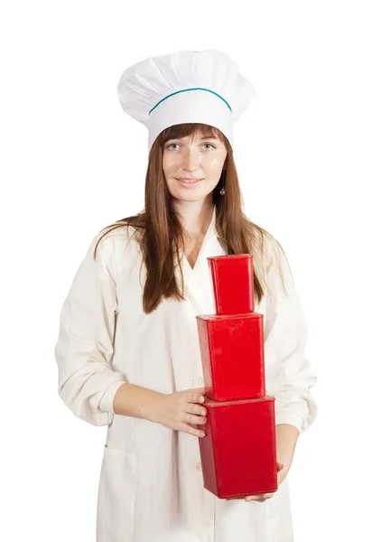 Female cook with red packages — Stock Photo, Image