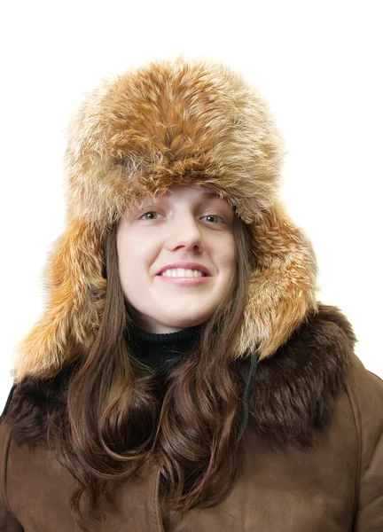 Mädchen in Schaffell und Hut mit Ohrenklappen — Stockfoto