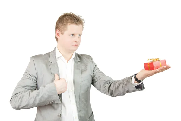 Businessman holding out a present box — Stock Photo, Image