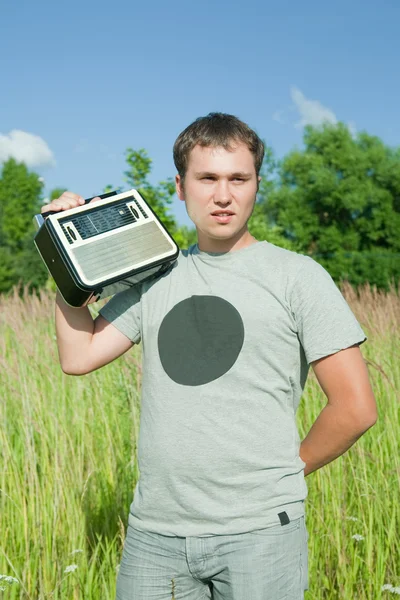 Man with old radio receiver — Stock Photo, Image