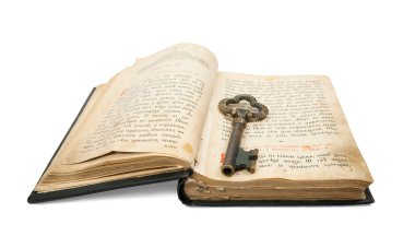 Key placed on vintage book clipart