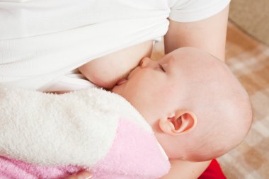 Baby breast feeding clipart