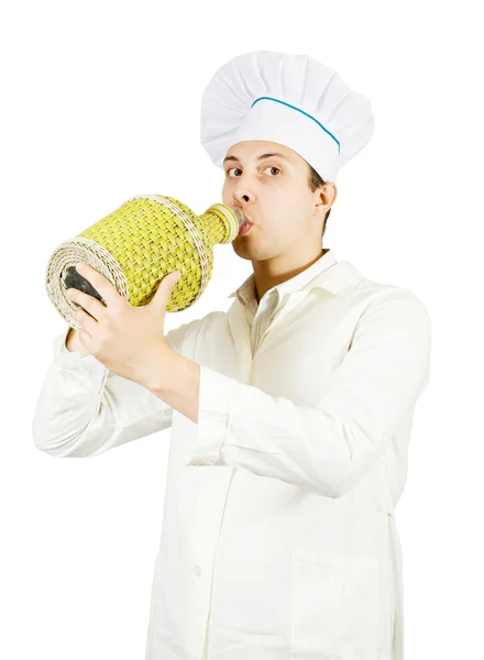Cook drinking from large bottle — Stock Photo, Image