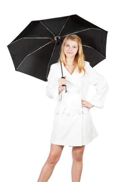 Девушка в плаще с зонтиком — стоковое фото