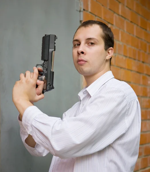 Hombre con arma —  Fotos de Stock
