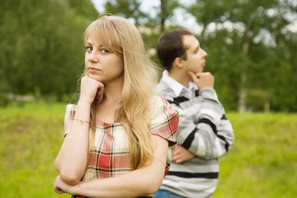 Young couple after quarrel outside Stock Photo