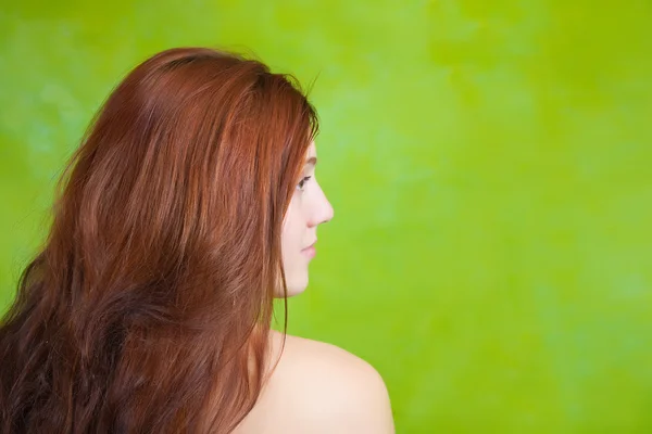 Long-haired girl over green — Stock Photo, Image