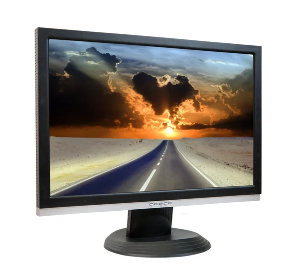 LCD-monitor met weg door woestijn — Stockfoto