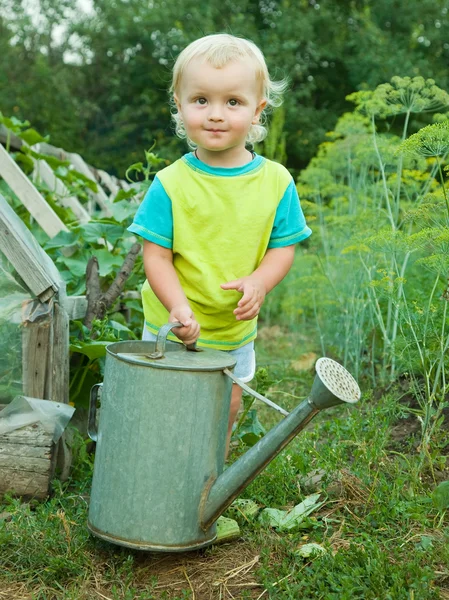 Baby boy with watering pot — Stock Photo, Image