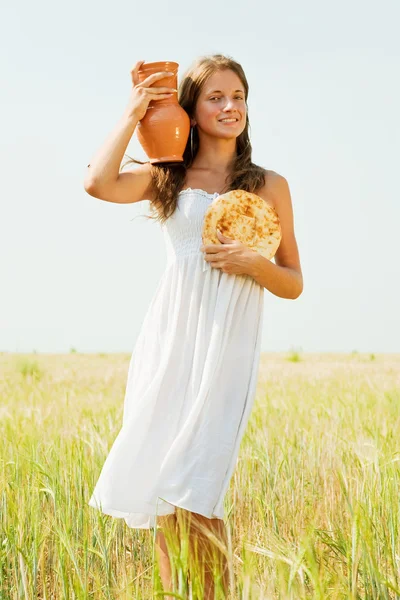 Girl with bread and jug — Stock Photo, Image